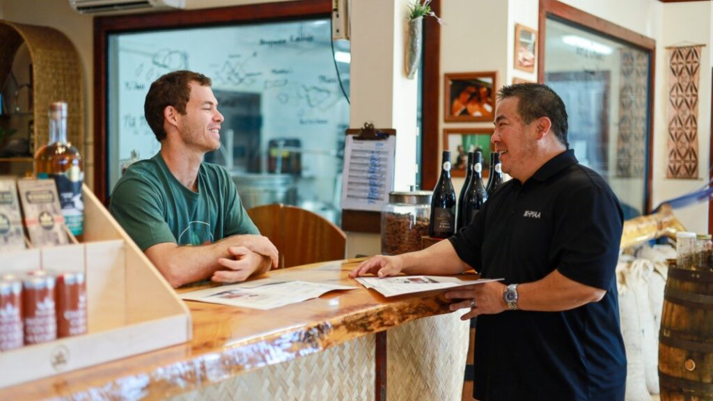 Hawaii health insurance agent explaining Association Health Plan options to local restaurant owner